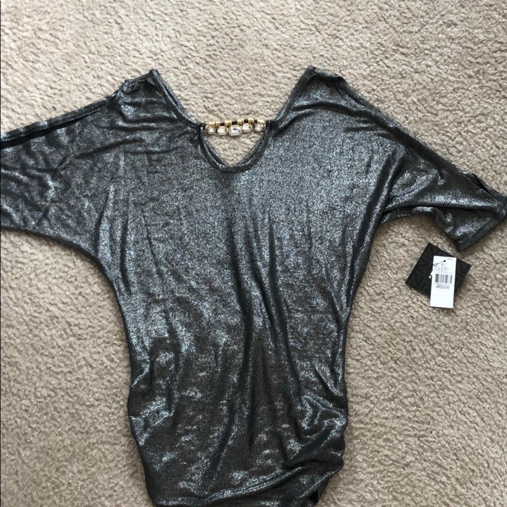 Black shimmering top with arm cut outs